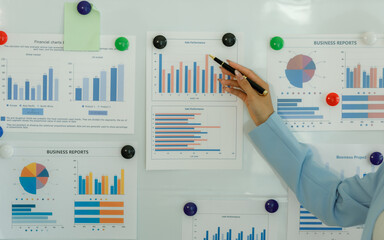 Analysts who study past consumer behavior in the market through statistical graphs to adapt and...