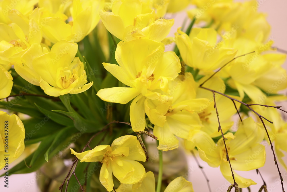 Poster a vase filled with bright yellow flowers sits atop a table, ideal for adding a pop of color to any s