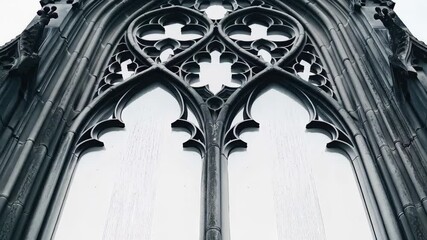 Close up view of a gothic pointed arch church window, featuring trefoil and quatrefoil patterns - Powered by Adobe