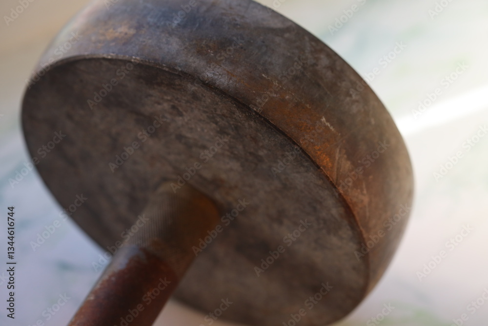 Aufkleber close-up view of a metal object sitting on a table.