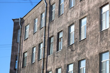 Fototapeta premium A modern building with a clock tower, suitable for use in architecture or cityscape images.