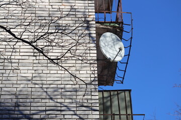 A clock on the side of a brick building, ideal for cityscapes and urban backgrounds.