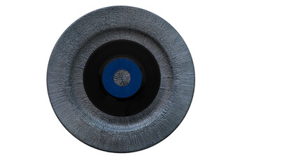 Vinyl record placed on a textured, circular plate, representing a blend of music and modern design