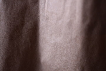 Fototapeta premium A cat sitting on a colorful curtain.