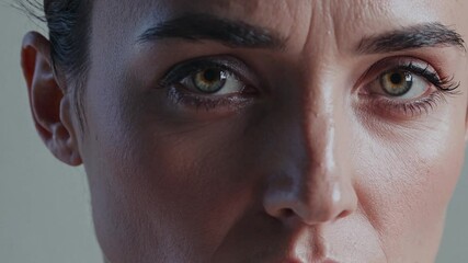 Close ups of a person's eyes convey intensity and concentration, highlighting emotions through subtle changes in expression