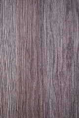 A close-up shot of a wooden table with a knife and fork, perfect for rustic or nature-inspired settings.