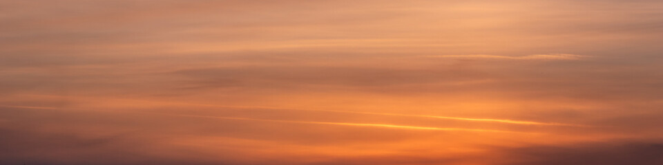 Obraz premium Epic Sunset View – Dramatic Clouds in Warm Orange and Pink Tones - Panoramic View