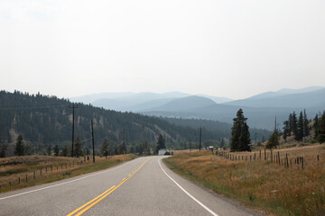 Fototapeta premium Highway in the mountains, Canada. The concept of travel and adventure. 