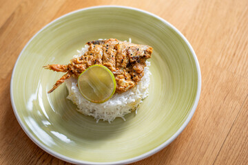 Fish curry with rice. Spicy pomfret fish curry gravy.