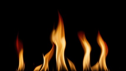 Fototapeta premium Dramatic flames against black background capturing intense fire motion