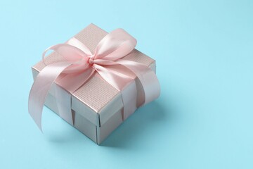 Beautiful gift box on color background