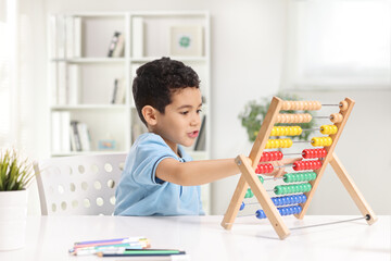 Kid counting on an abacus