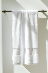 White Bath Towels Hanging on Modern Brushed Nickel Towel Bar