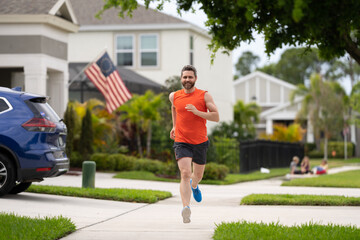 Sport fit runner jogging. Jogging activity. Running man run down the neighborhood. Jogging man enjoy the freedom of running outdoor. Man runner running training during the run. Outdoor workout