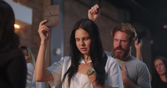 Young woman of African descent holding offering envelope during church worship, diverse group of people in background, serene expression, moment of faith and spiritual reflection