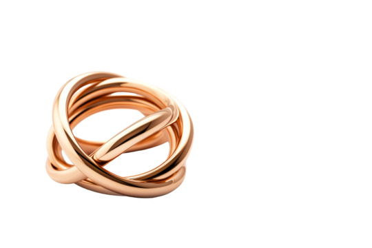 Gold rings intertwined on clear backdrop