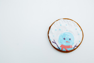 Festive Winter Cookie Decorated With Playful Snowman Design on a White Background