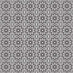 Ornate repeating black and white pattern