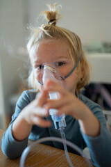 Young Child Undergoing Nebulizer Therapy for Respiratory Treatment at Home