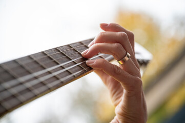 Closeup of playing the guitar