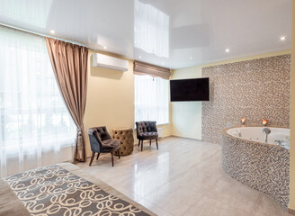 Modern Home Bedroom Interior with Large Windows and Chic Bathroom Amenities