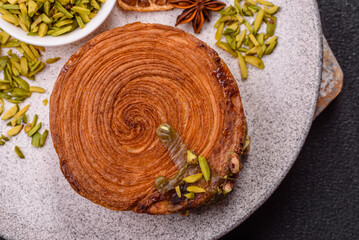 Round puff pastry croissant with pistachio filling or new york roll