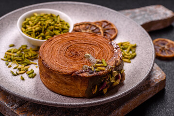 Round puff pastry croissant with pistachio filling or new york roll