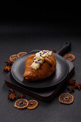 Sweet crispy fresh croissant with berry filling