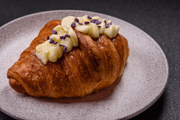 Sweet crispy fresh croissant with berry filling