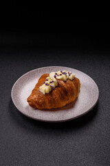 Sweet crispy fresh croissant with berry filling