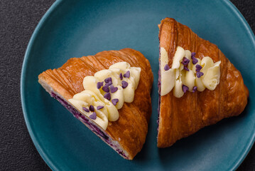 Sweet crispy fresh croissant with berry filling