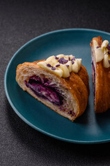 Sweet crispy fresh croissant with berry filling