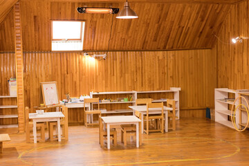 Cozy Montessori classroom with wooden furniture