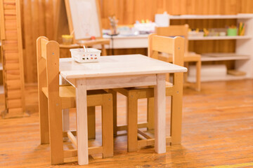 Cozy Montessori classroom with wooden furniture