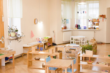 Montessori classroom with wooden furniture