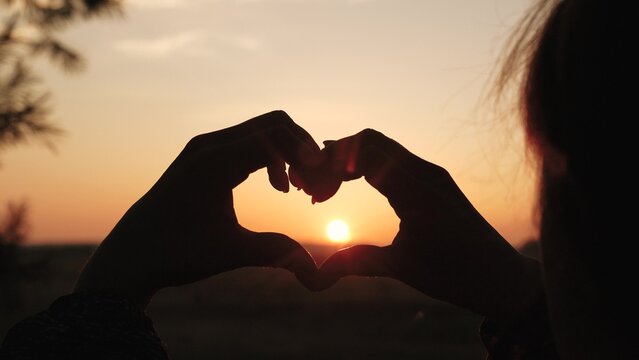 girl heart sign, sunset love symbol, hand silhouette heart, romantic gesture sunset, love hand silhouette, heart shape hands, fingers forming heart, romantic sign sunset, symbol of love sky, romantic