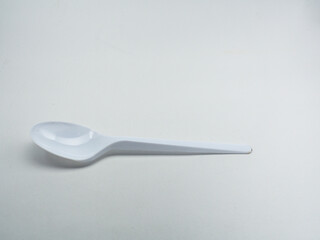 white plastic spoon isolated on white background