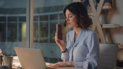 Businesswoman calling evening office discussing problem closeup. Overworked ceo 
