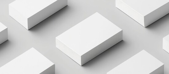 White rectangular boxes are arranged on a plain gray background