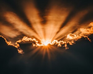 Dramatic view of a bright sun radiating through the clouds