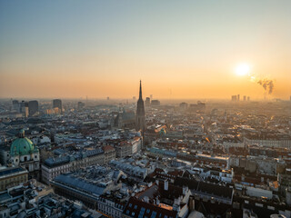 Vienna skyline with St. Stephen's Cathedral at sunrise, aerial view