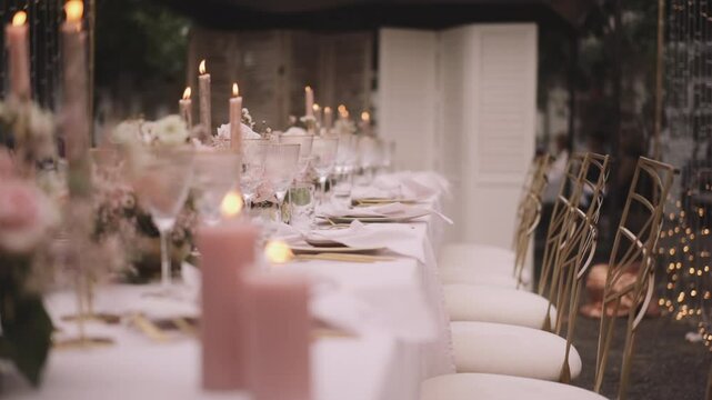 Wedding table in pastel colors with elegant decorations and yellow string lights  - Powered by Adobe