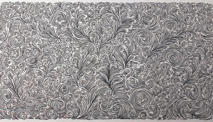 Intricate swirling patterns in black and white, metal engraving artistry