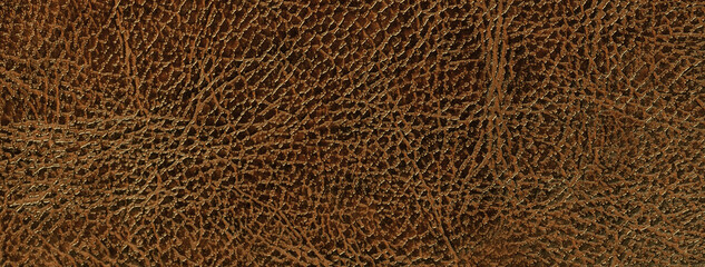Lacquered dark brown leather texture background with pattern, macro. Structure of bronze textile backdrop