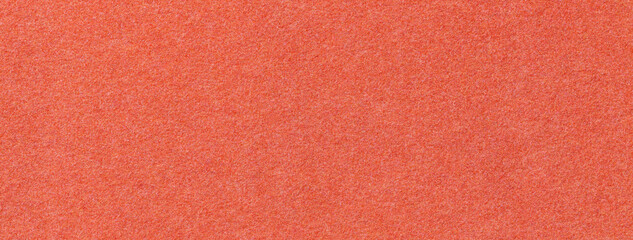 Texture of dark red and coral color background from felt textile material, macro. Structure vintage ginger fabric cloth