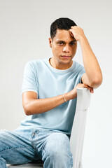 young man sitting on a chair