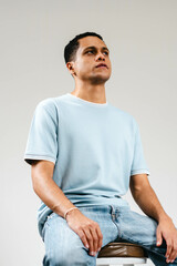 handsome young man sitting on a chair