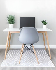 Minimalist home office setup with laptop, plants, and grey chair
