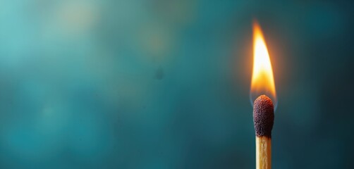 Detailed close-up of burning match with flame against blurred blue. Single matchstick ignites, creating warm, bright light, combustion effect, fire blaze. Minimalist ignition photo idea.