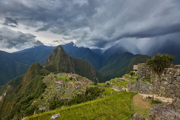 Fototapeta premium Perched high in the Andes, Machu Picchu stands as a testament to the brilliance of the Inca civilization. Surrounded by misty peaks and lush greenery, this ancient wonder inspires awe and reverence